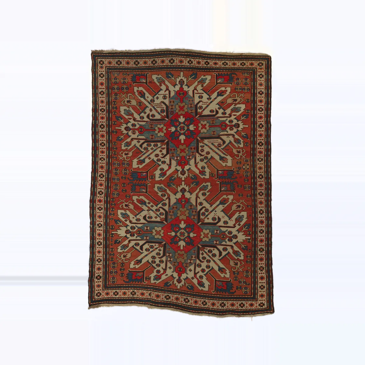 Tapis ancien noué main à médaillons rouges et bleus, XIXe siècle : type de pièce estimée et rachetée au Maroc